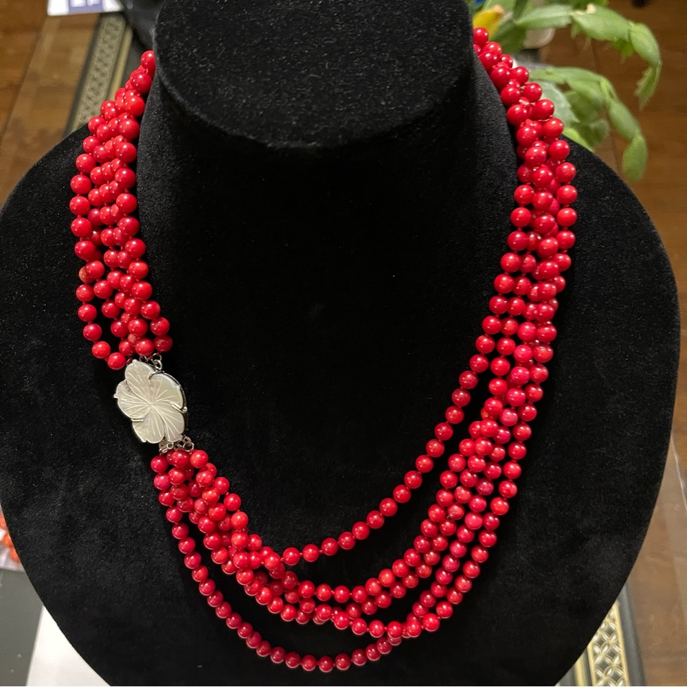 Red Corral Multi Strand Neclace with a mother of pearl flower design